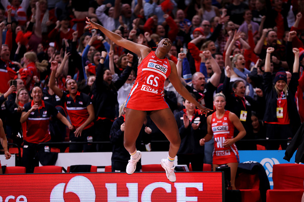 Now-former NSW Swifts shooter Romelda Aiken-George leaps in the air after their elimination final...