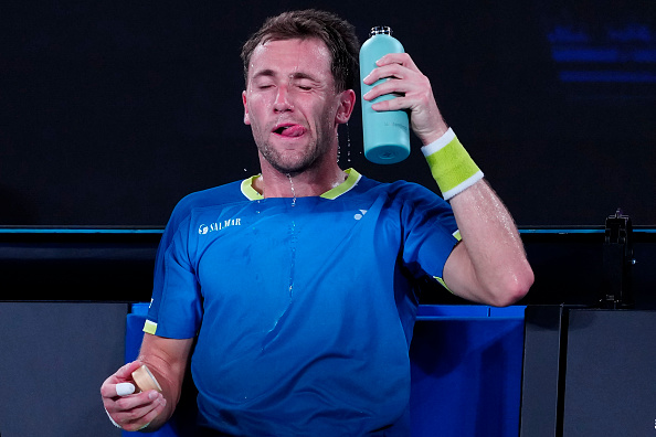 Casper Ruud tries to keep cool during sweltering conditions at the weekend. The Norwegian was...