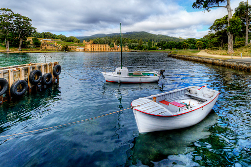 Boats with Port Arthur Historic Site in the Background, Tasman Peninsula, Tasmania, Australia....