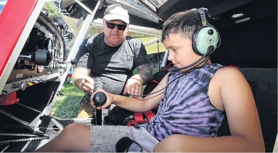 Kohen Dodd experiences the view from the cockpit of Lionel Green’s Savannah S aircraft on show at...