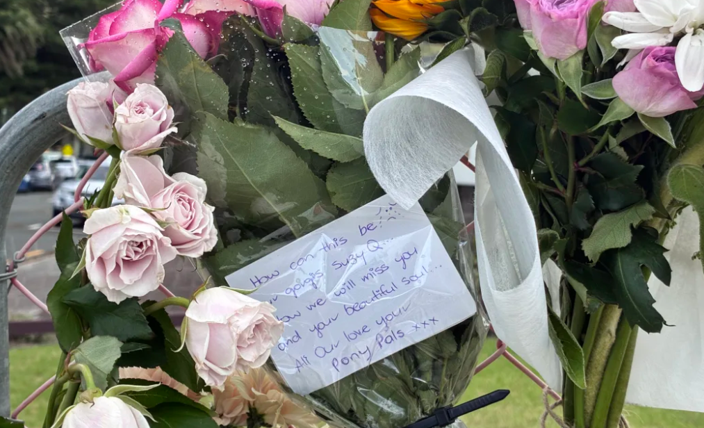 A floral tribute left for Susan Knowles at the Mt Maunganui landslide cordon. Photo: RNZ