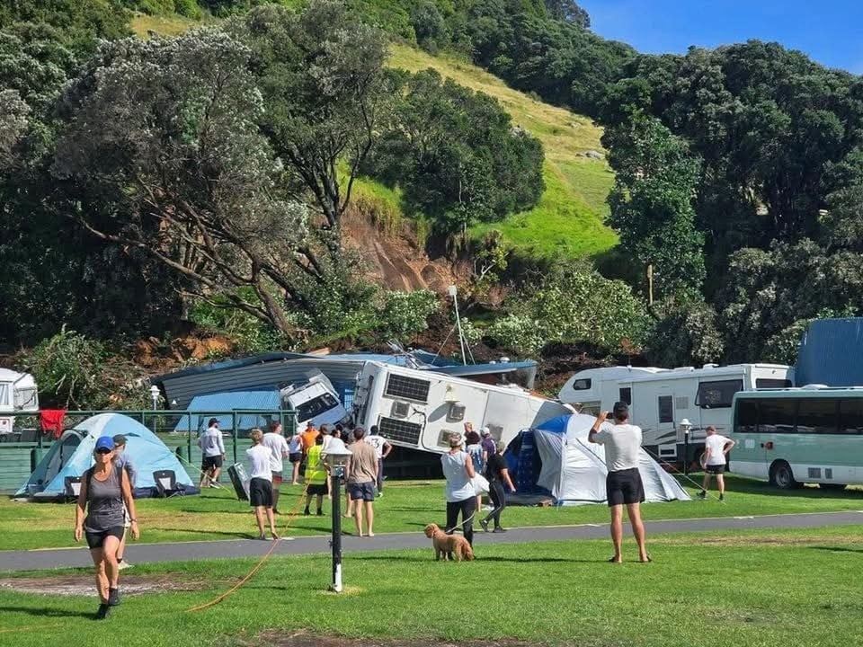 People at the scene of the slip at the  Beachside Holiday Park. Photo: Supplied/Shirley Thomas...