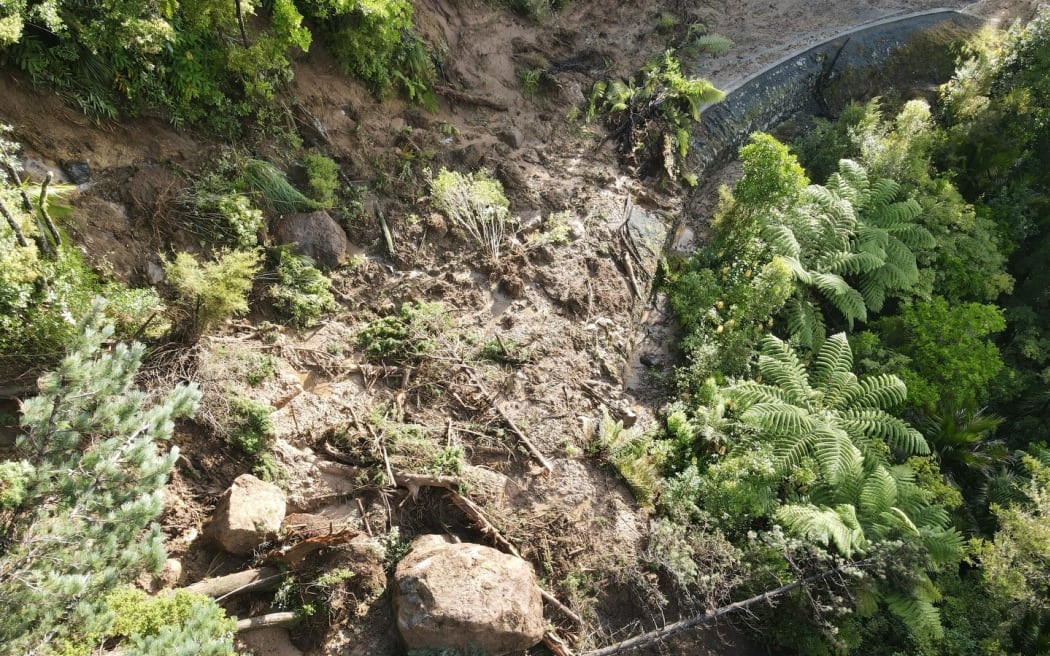 Some of the boulders blocking Russell Rd will have to be broken up using a hydraulic breaker or...