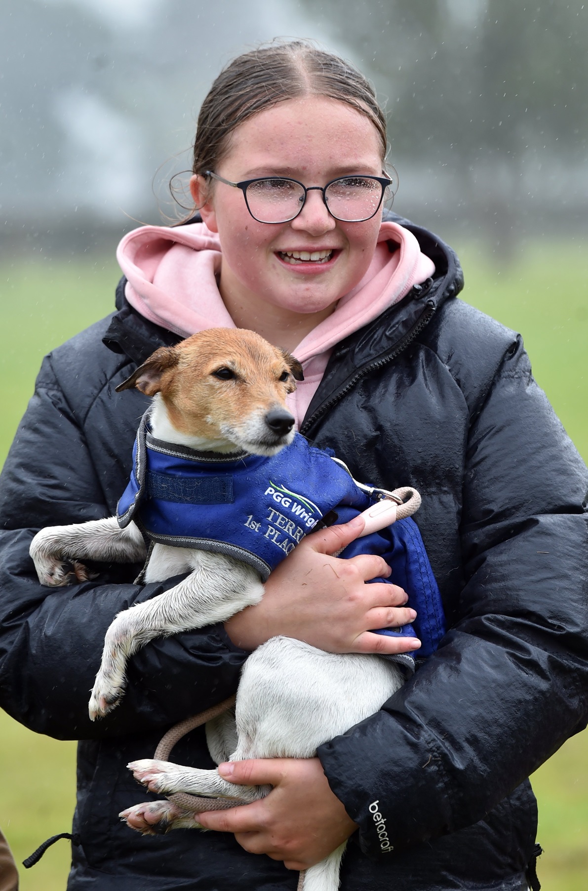 Grace Cook holds her winning dog, Bella.

