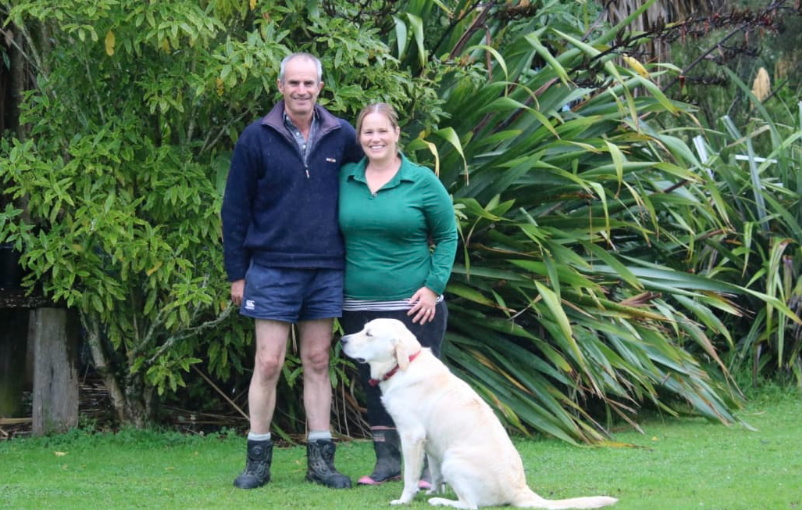 Simon and Camille McAtamney with their dog Beau. The pair say there are still thousands of trees...