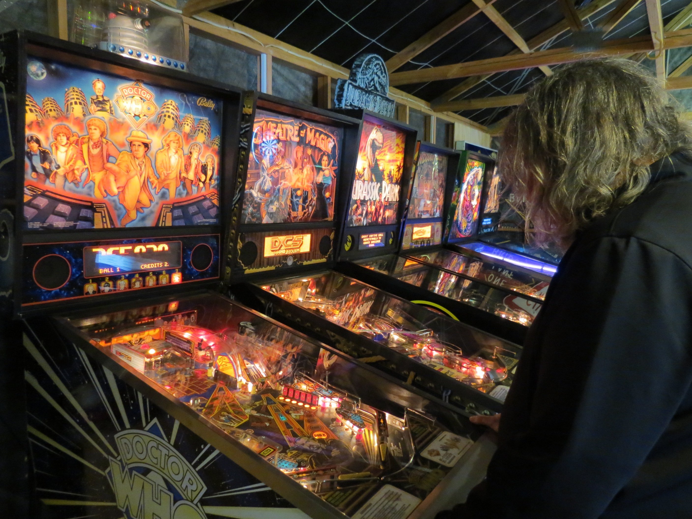 Jonathan Usher dials in playing the Doctor Who-themed pinball machine, similar to the one he...