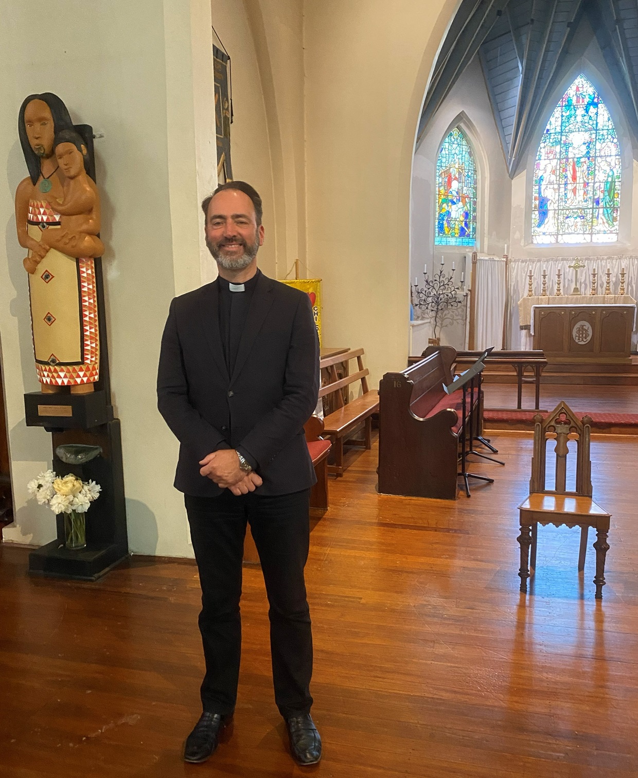 Canon Wallace stands in the sanctuary of All Saints’. Photo: Brenda Harwood