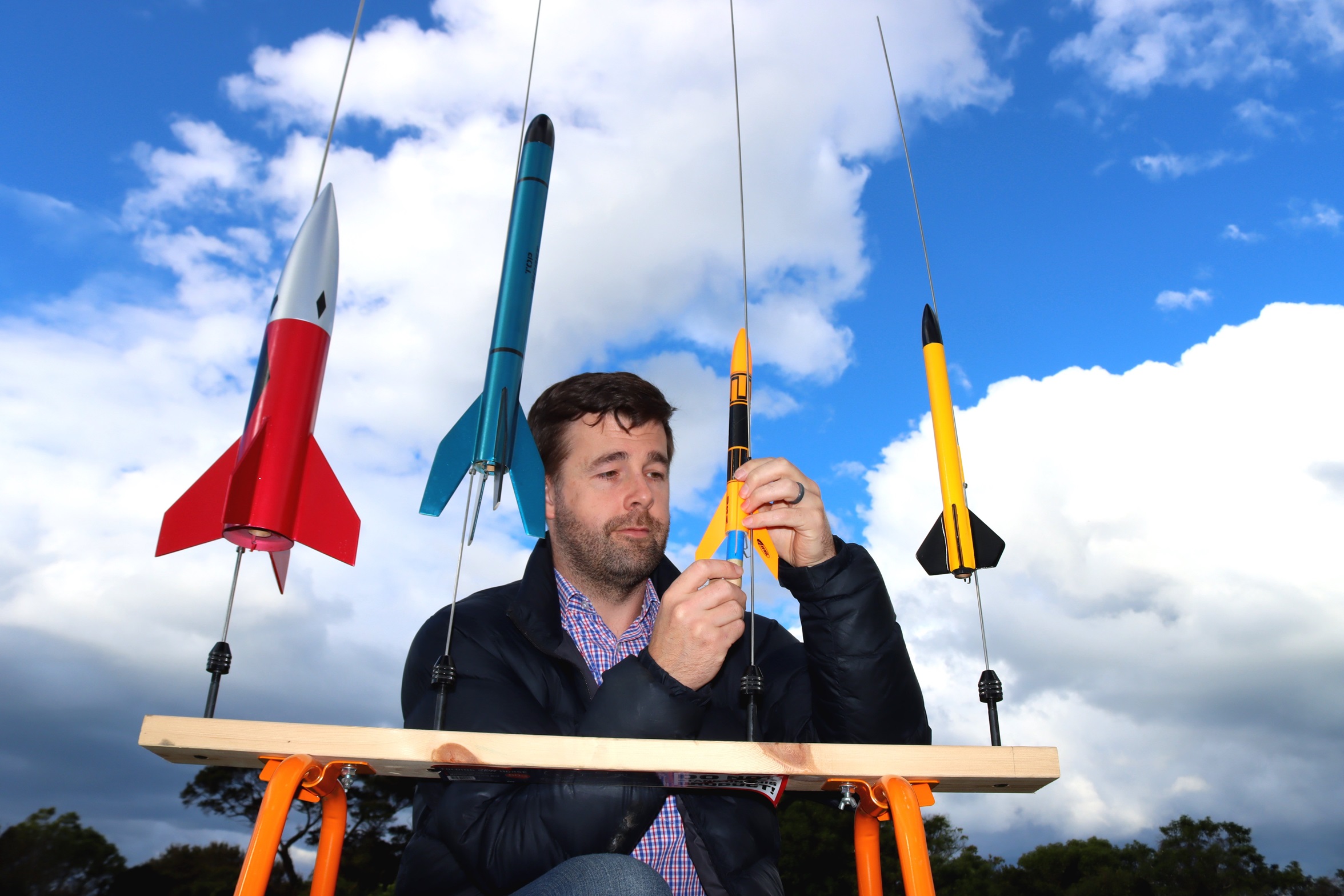 Otago Rocketry Club founder Mike Turner checks a model before workshops during Techweek. Photo:...