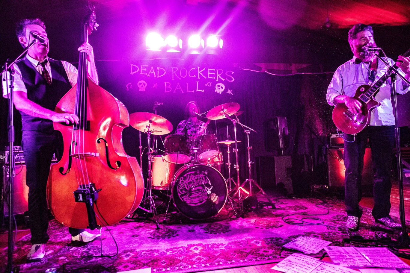 Rock trio Bulletproof Convertible perform during a recent Dead Rockers Ball community fundraising...