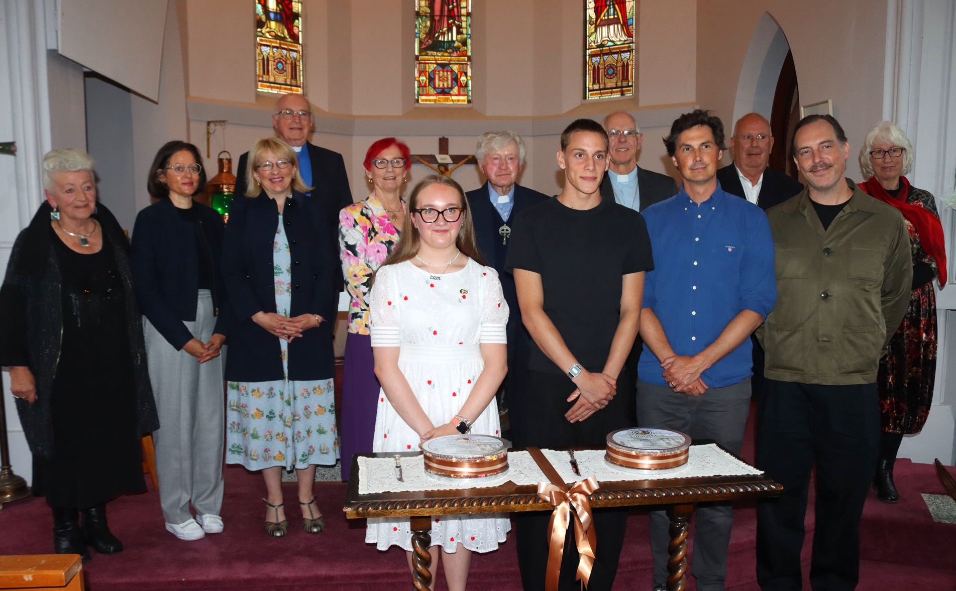 Representatives gather behind the descendants of Thomas Pound during the commemorative celebration. 