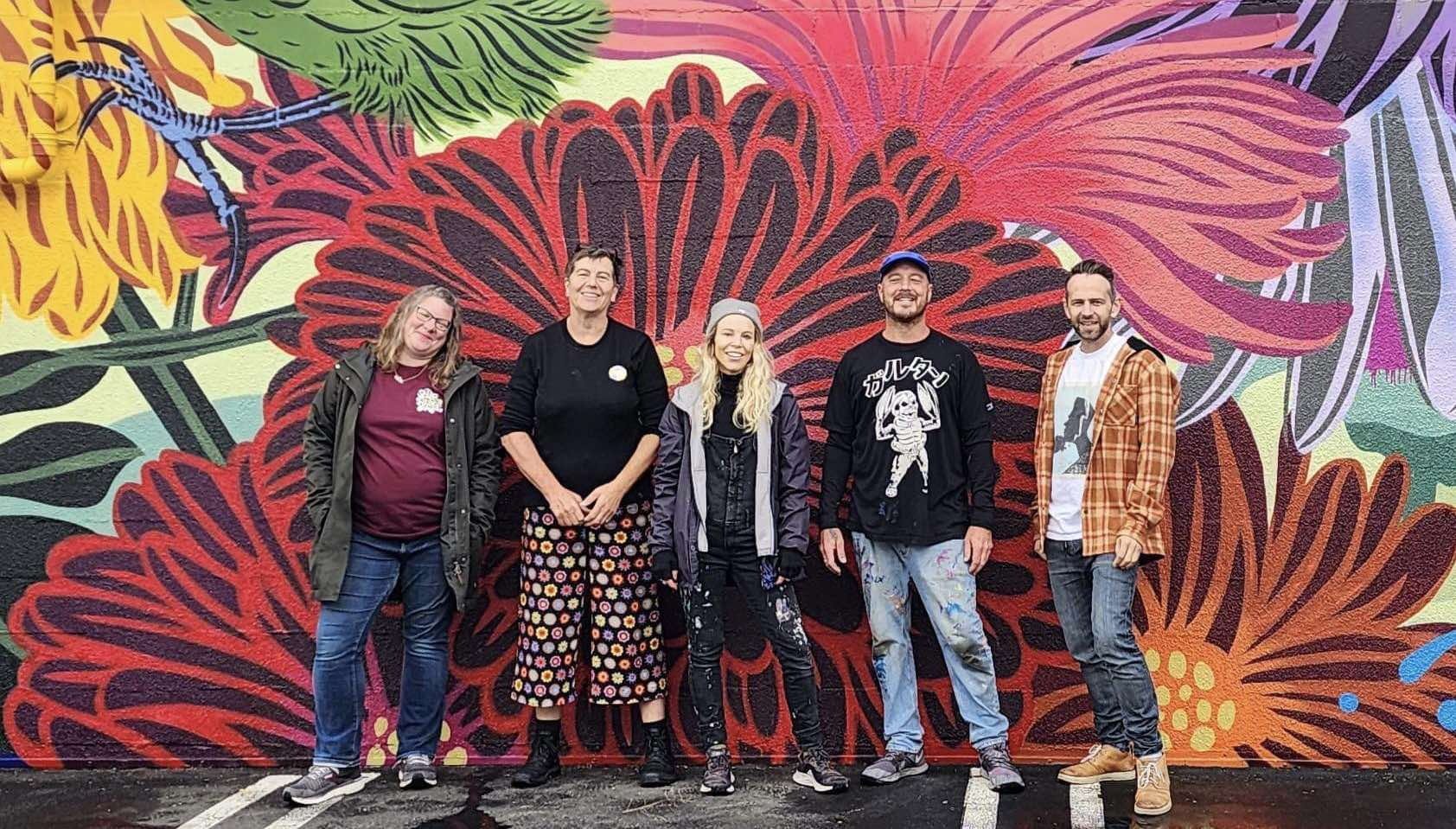 South Dunedin Street Art Trail team members, (from left) Claire Rye, Rachel Elder, artists Flox ...