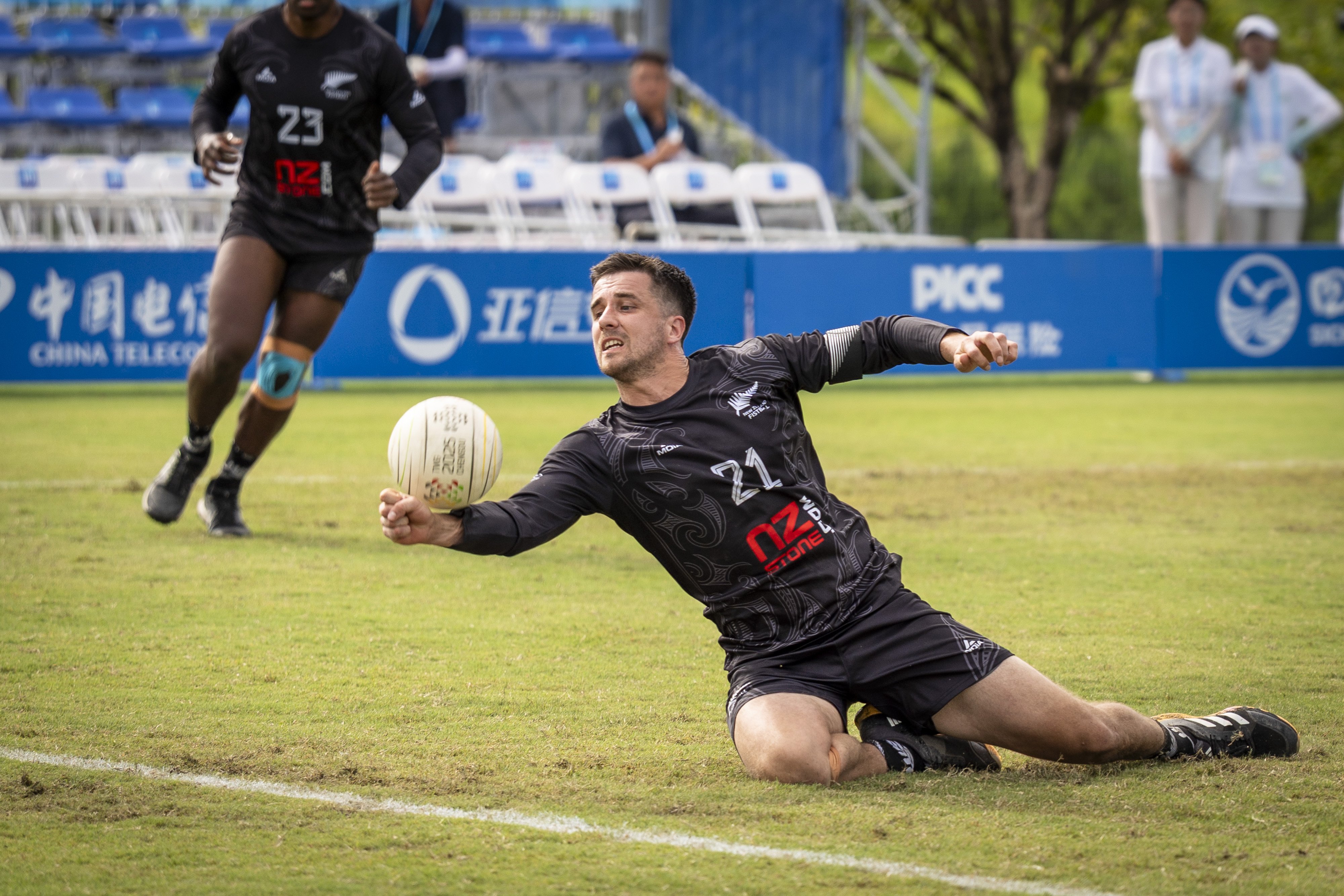 New Zealand captain and under-18 coach Samuel Kempf pulls off an impressive dive while competing...
