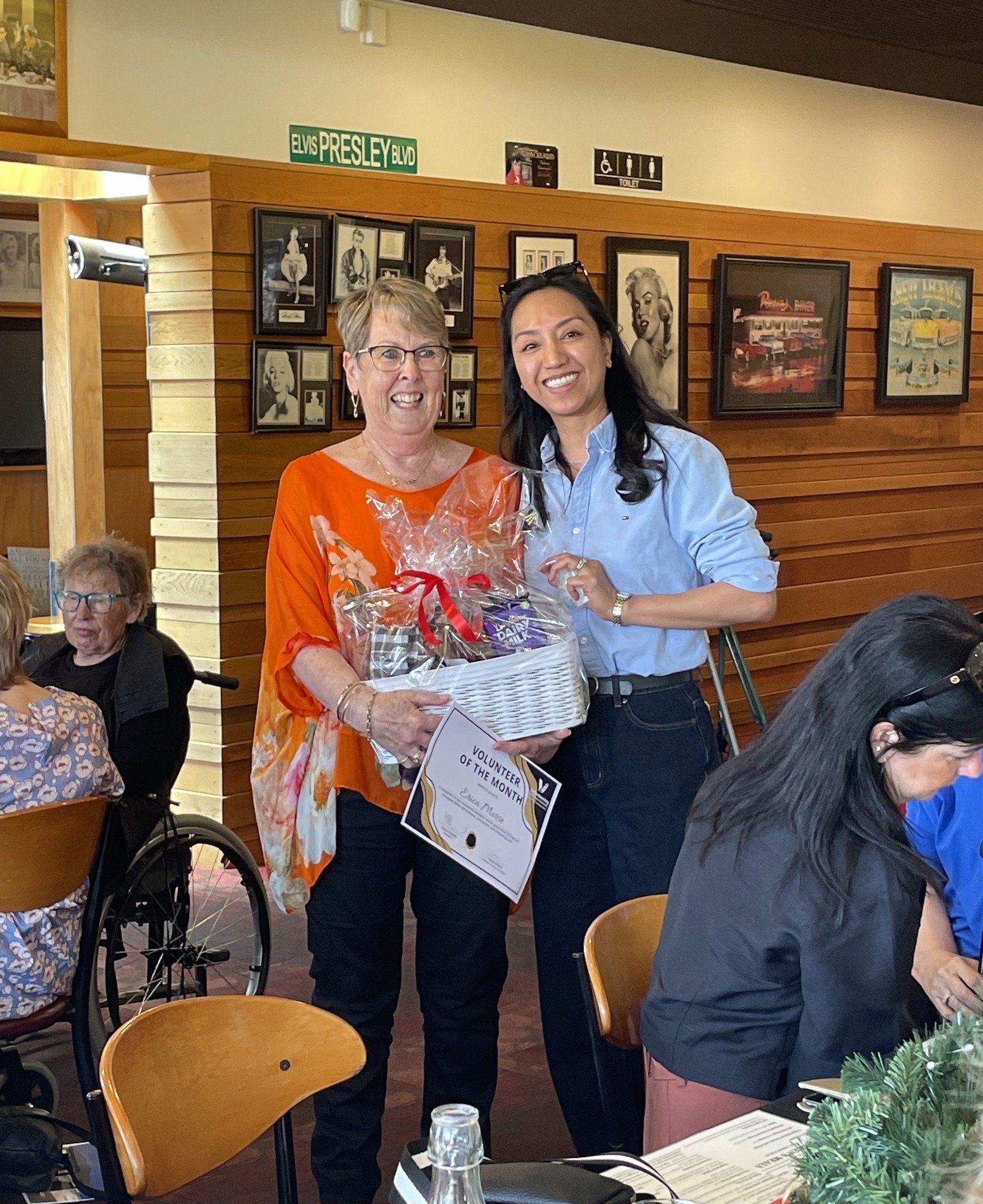 Erica Morse (left) is presented with her award from Volunteering South Canterbury manager Haidee...
