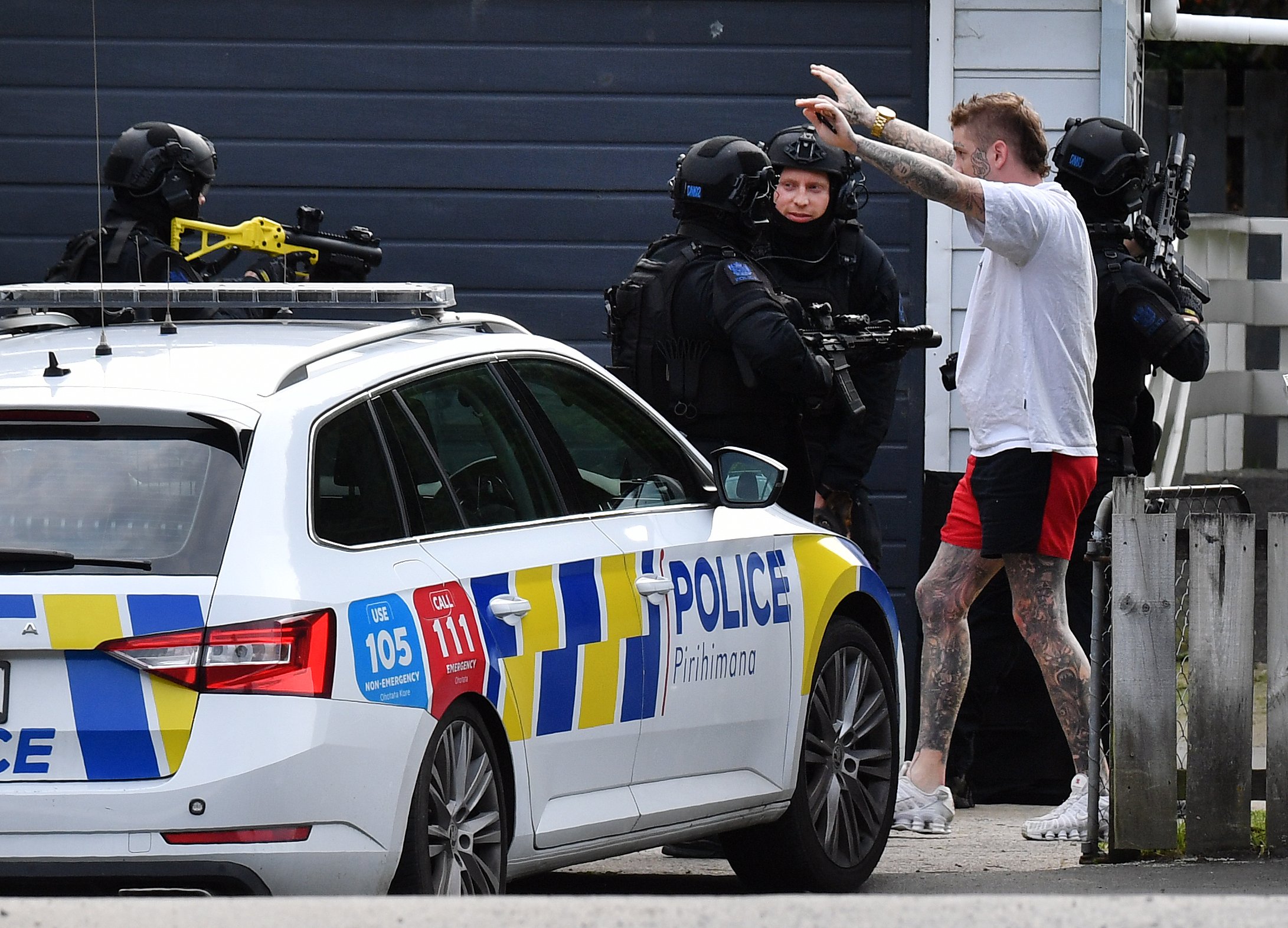 Police arrest wanted man Caleb Lynn in Kaikorai Valley on Saturday afternoon. Nine cars with...