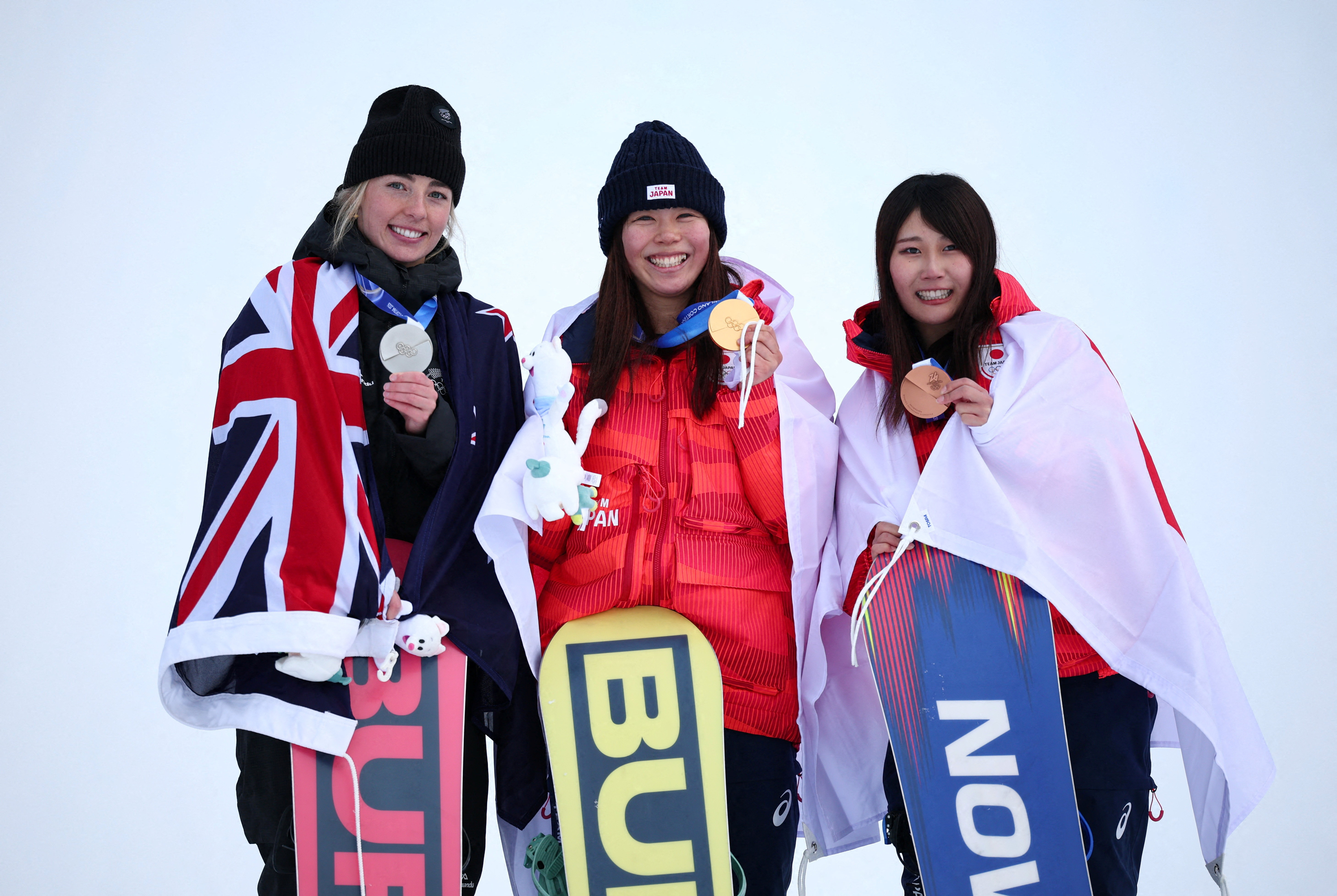 Gold medallist Mari Fukada (centre) with silver medallist Zoi Sadowski-Synnott and bronze...