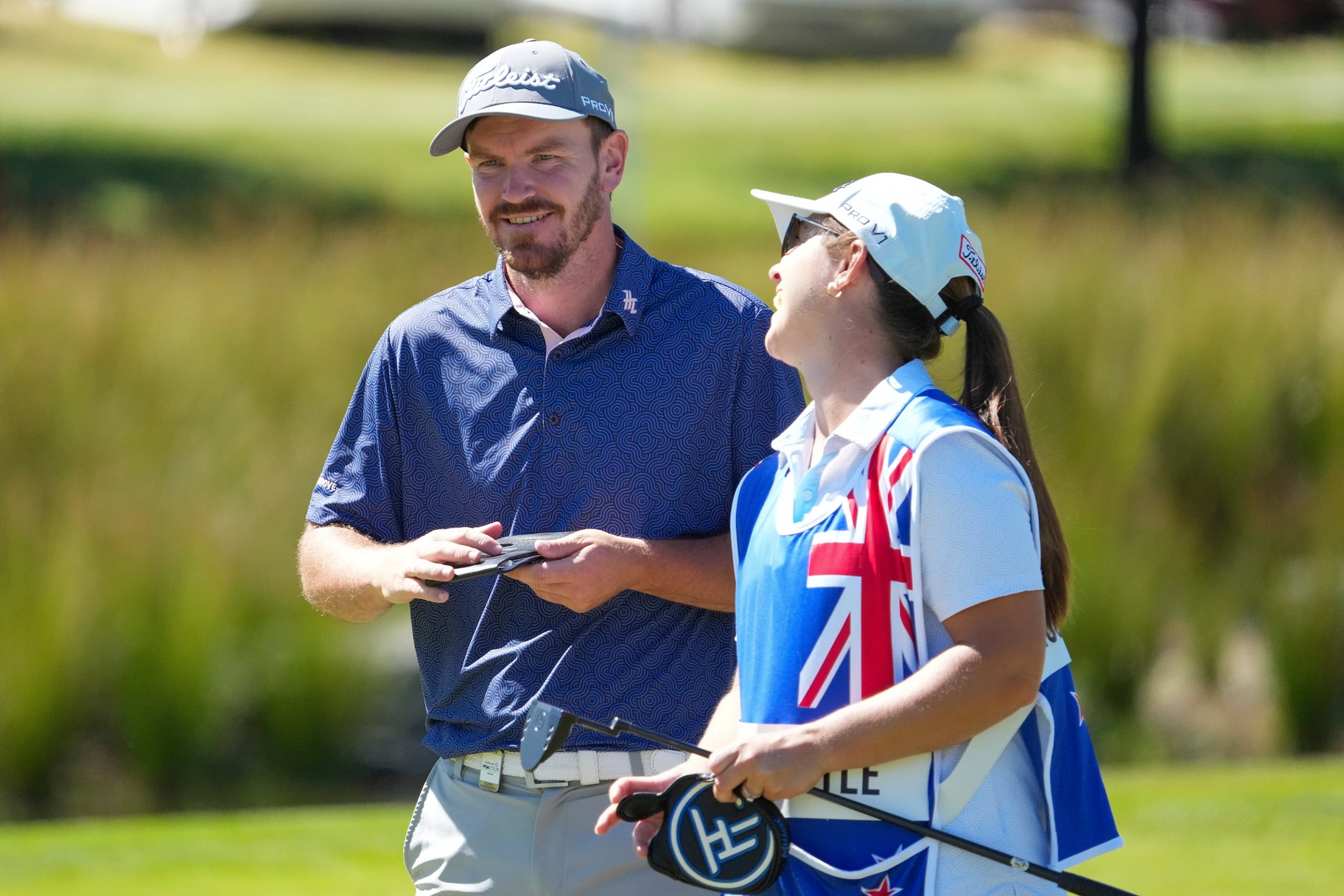 Masterton golfer Kerry Mountcastle shares a lighter moment with caddie and fiancee Georgia Brown...