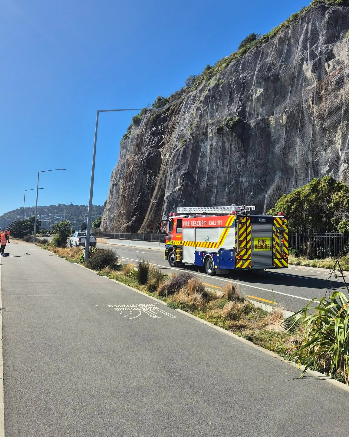 Firefighters at the scene of the rockfall on Wednesday morning. Photo: Sumner Volunteer Fire Brigade