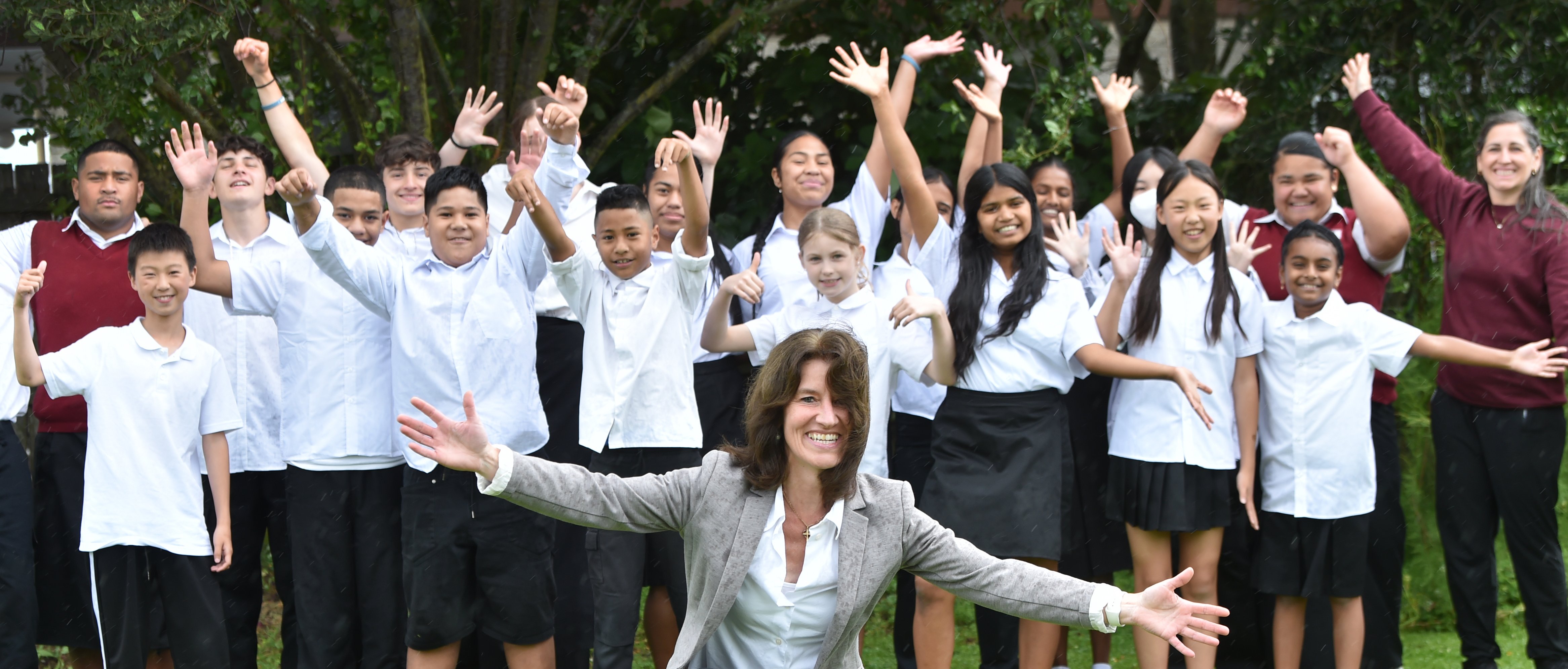 Amana Christian School principal Jana Magens with the students on Monday. PHOTO: PETER MCINTOSH