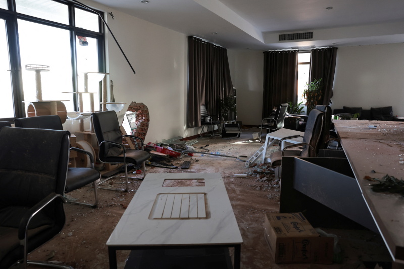 A private room where managers overseeing scam operations stayed, is amid debris inside a compound...