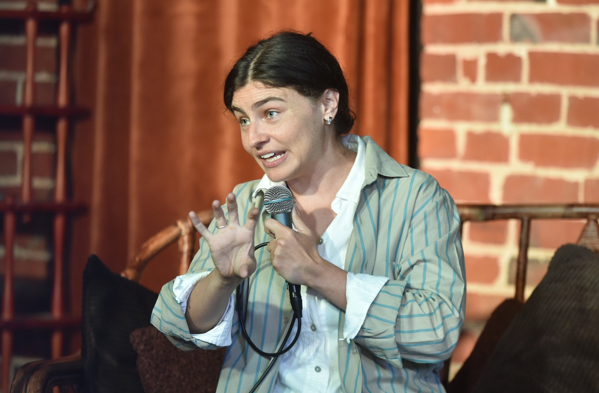 Chlöe Swarbrick expounds to a full house at a public meeting in Dunedin on Wednesday. Photos:...