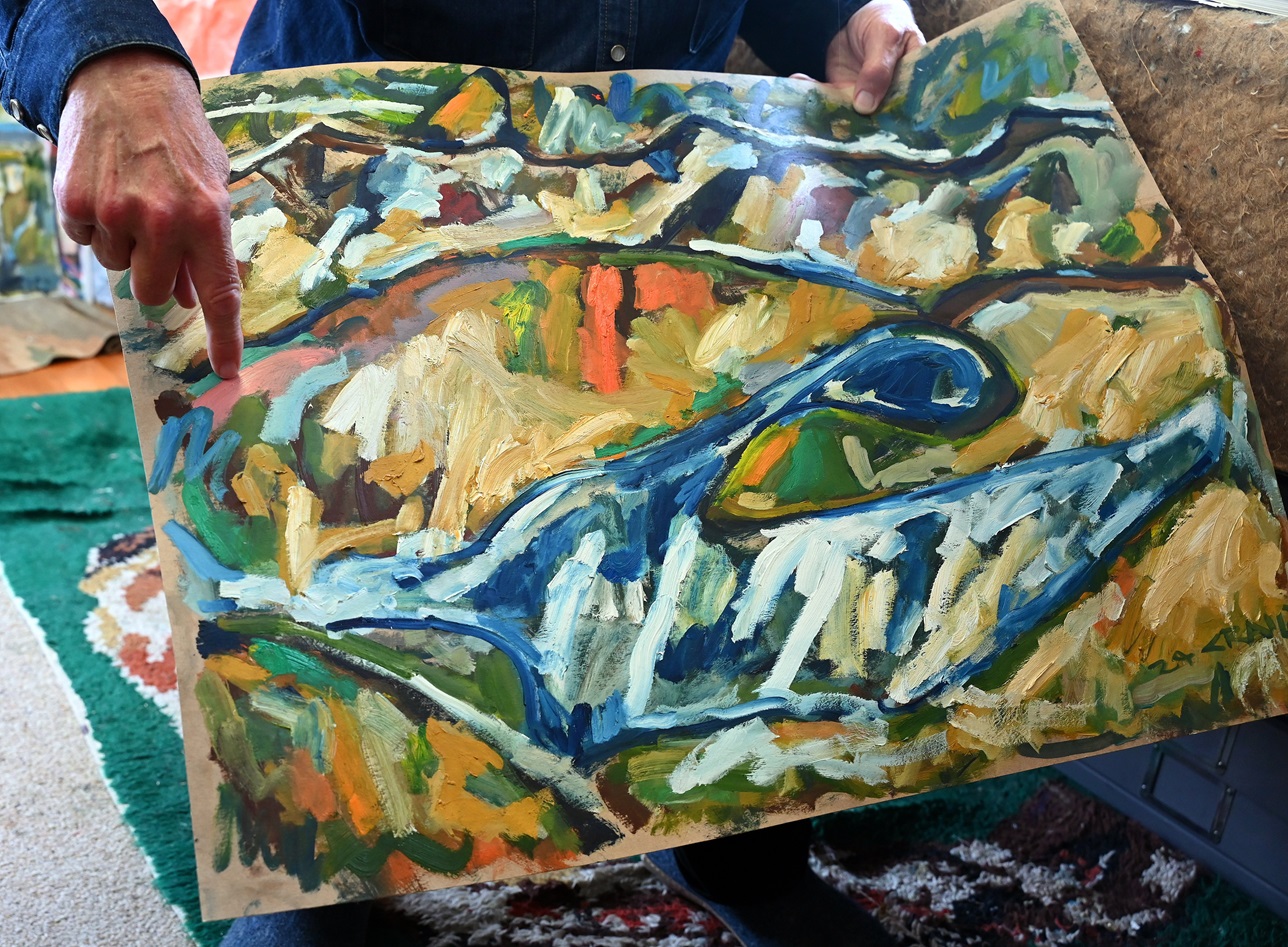 David Craig points out the contour lines in his work that give his paintings their base.