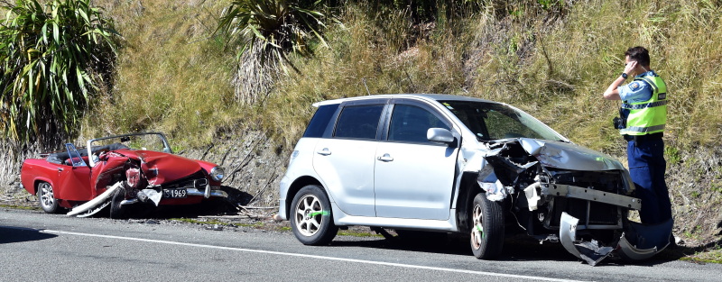 Two cars, including a 1969 Austin Sprite, are left in a mangled condition following a crash that...