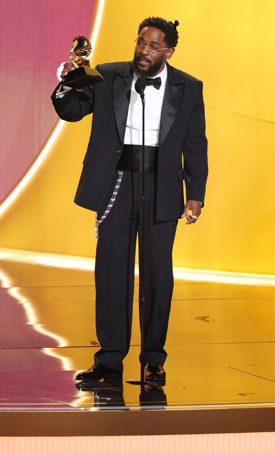 Kendrick Lamar lifts another award at the Grammys. Photo: TNS