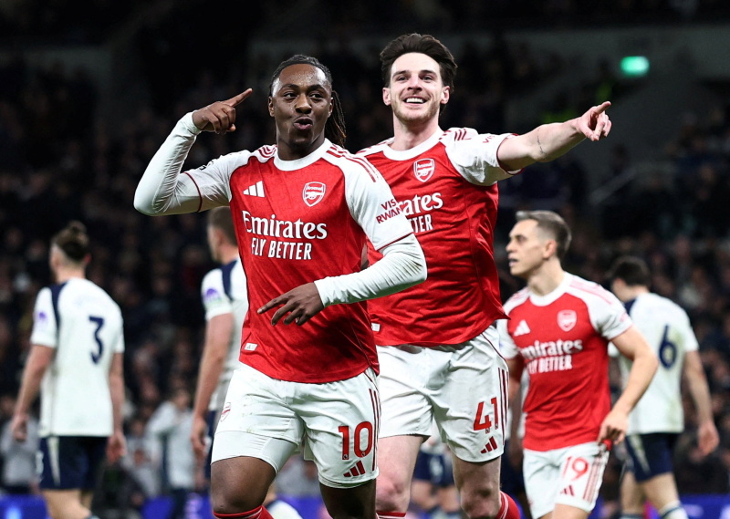 Arsenal's Eberechi Eze celebrates scoring their third goal with Declan Rice during their win over...
