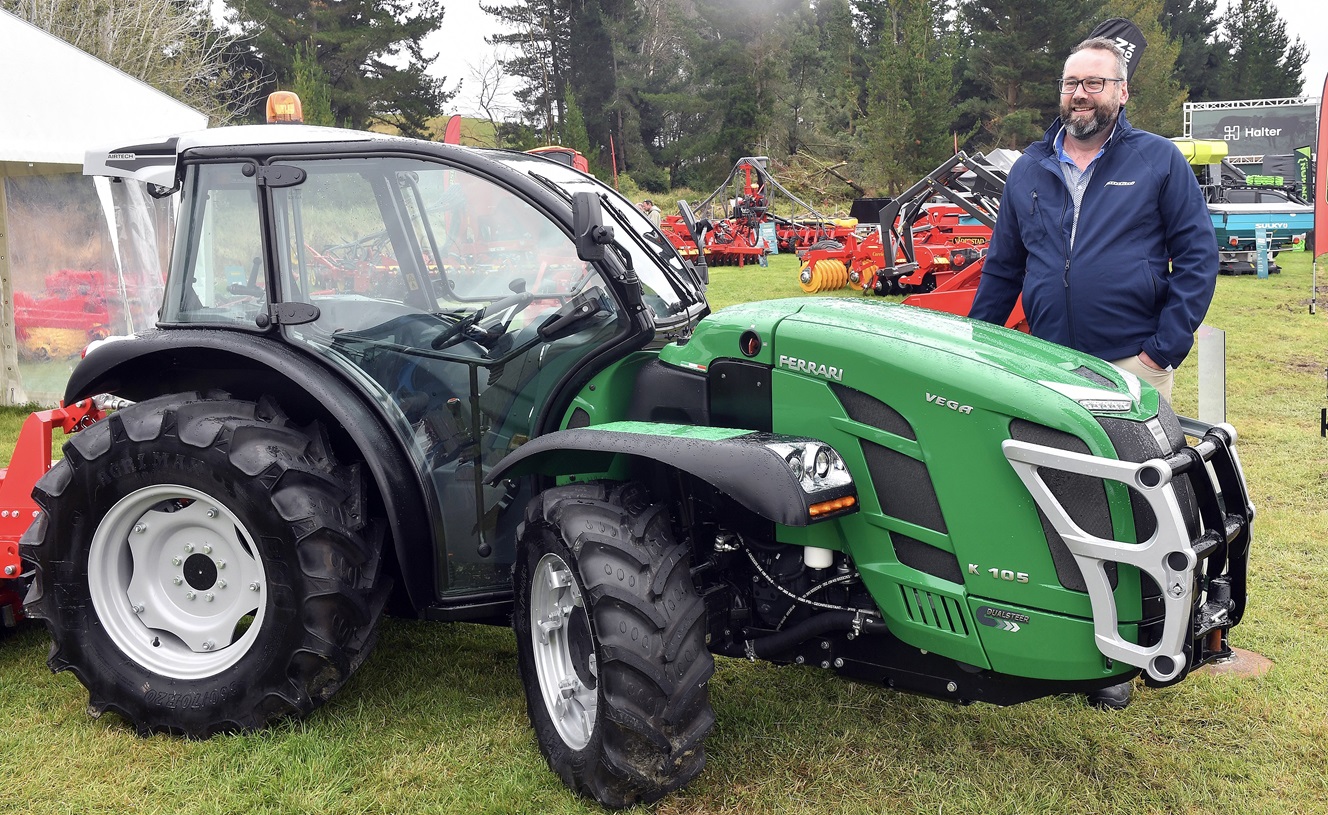 Zed Wholesale operations manager Andrew Dunlop with a tiny Ferrari orchard tractor. Photo:...