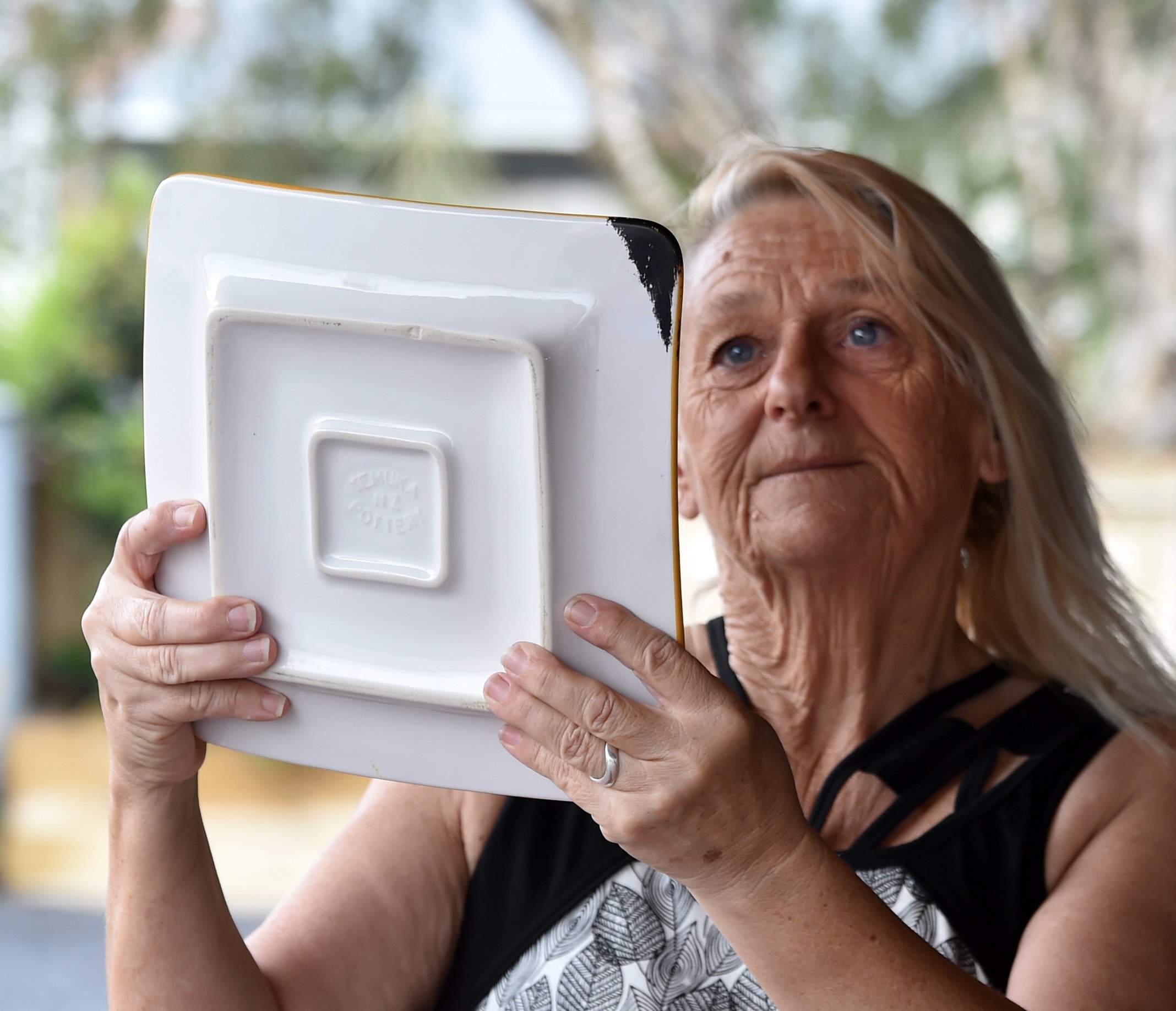 The couple managed to save pieces of Temuka pottery, a few of which have blackened corners: "We...