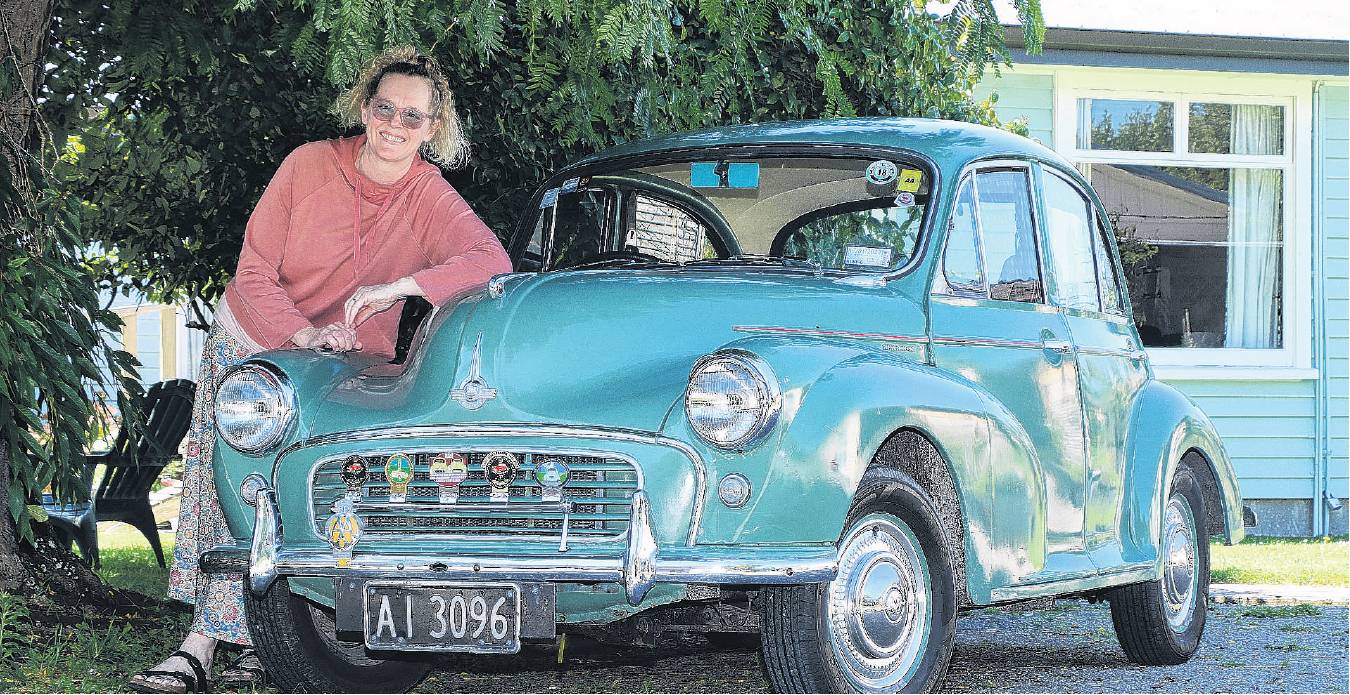 Anita van der Velden with Audrey, her 1959 Morris Minor 1000 four door sedan. PHOTO: JOHN COSGROVE