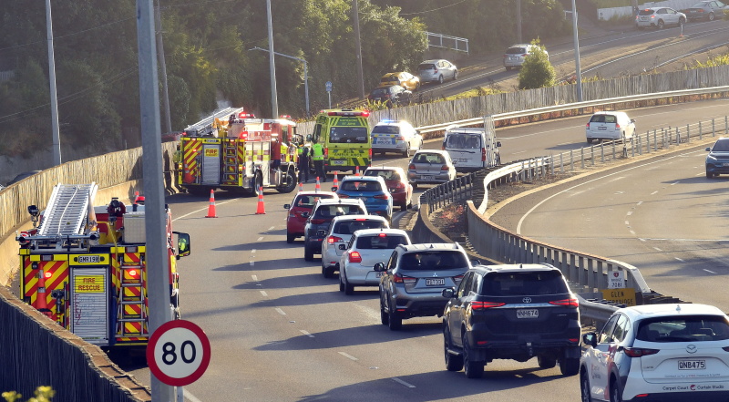 Emergency services attend a crash on the Southern Motorway in Dunedin this morning. Photo:...
