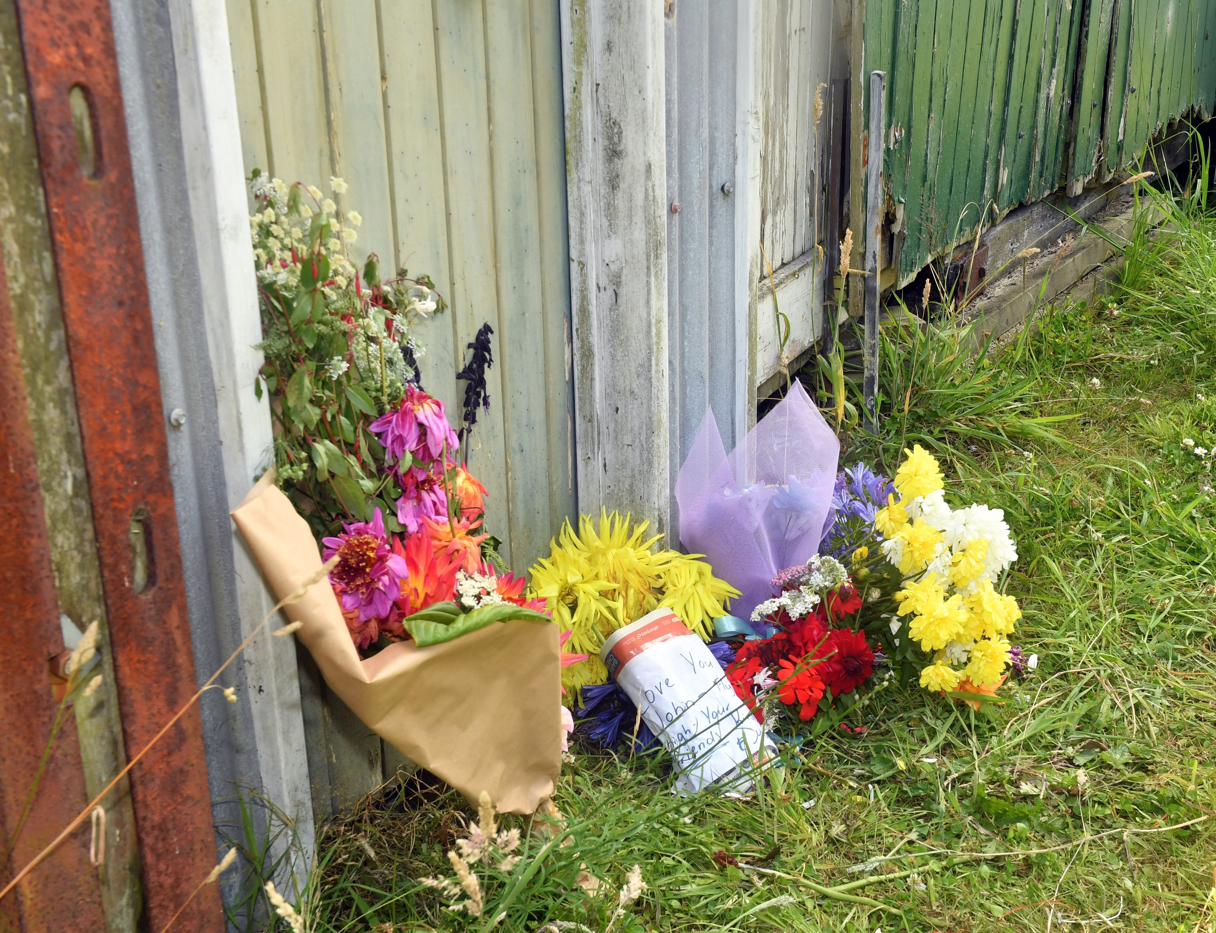 Flowers were laid next to a newly replaced power pole after a fatal car crash in Wickcliffe Tce...