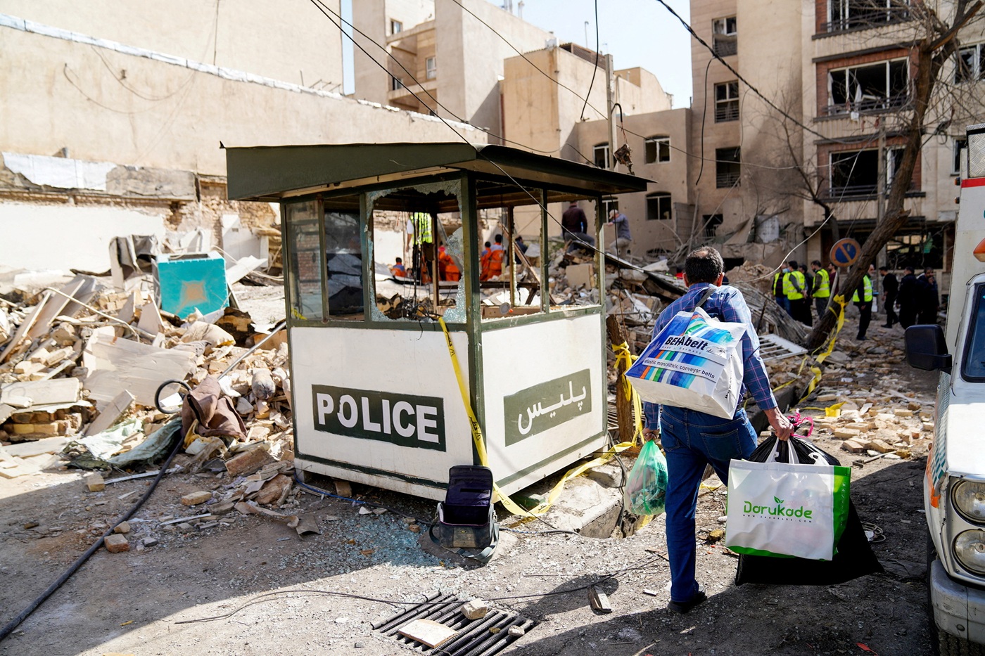 Debris lies around a building hit during the US-Israeli strikes in Tehran. Photo: Amir Kholousi...