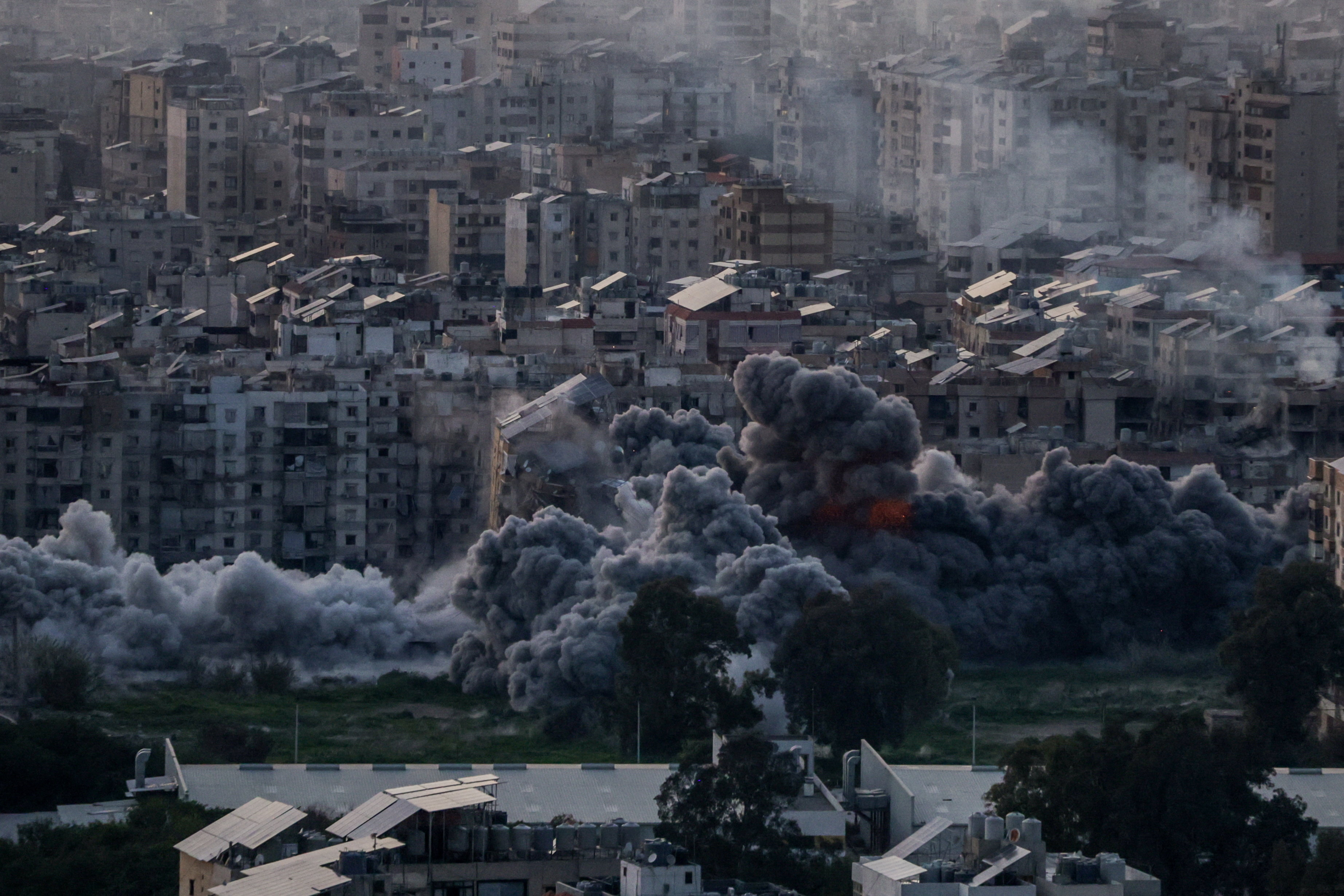 Smoke rises after an Israeli strike on Beirut's southern suburbs in Lebanon on Friday. Photo:...