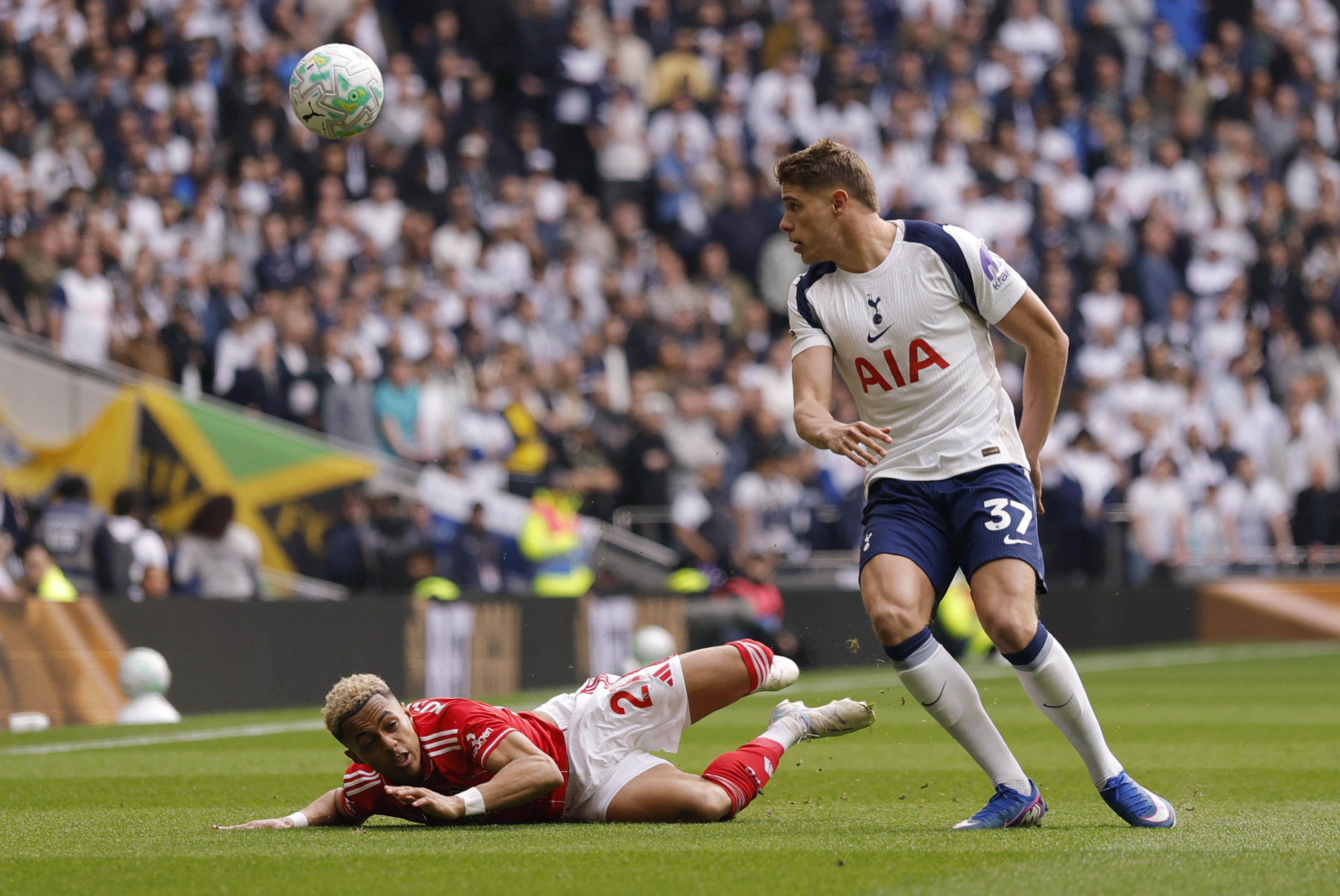 Tottenham Hotspur's Micky van de Ven (right) in action with Nottingham Forest's Omari Hutchinson....