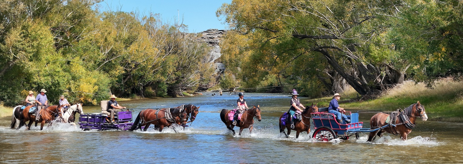 Crossing the Taieri River on the way to their camp near Middlemarch are members of the Otago...