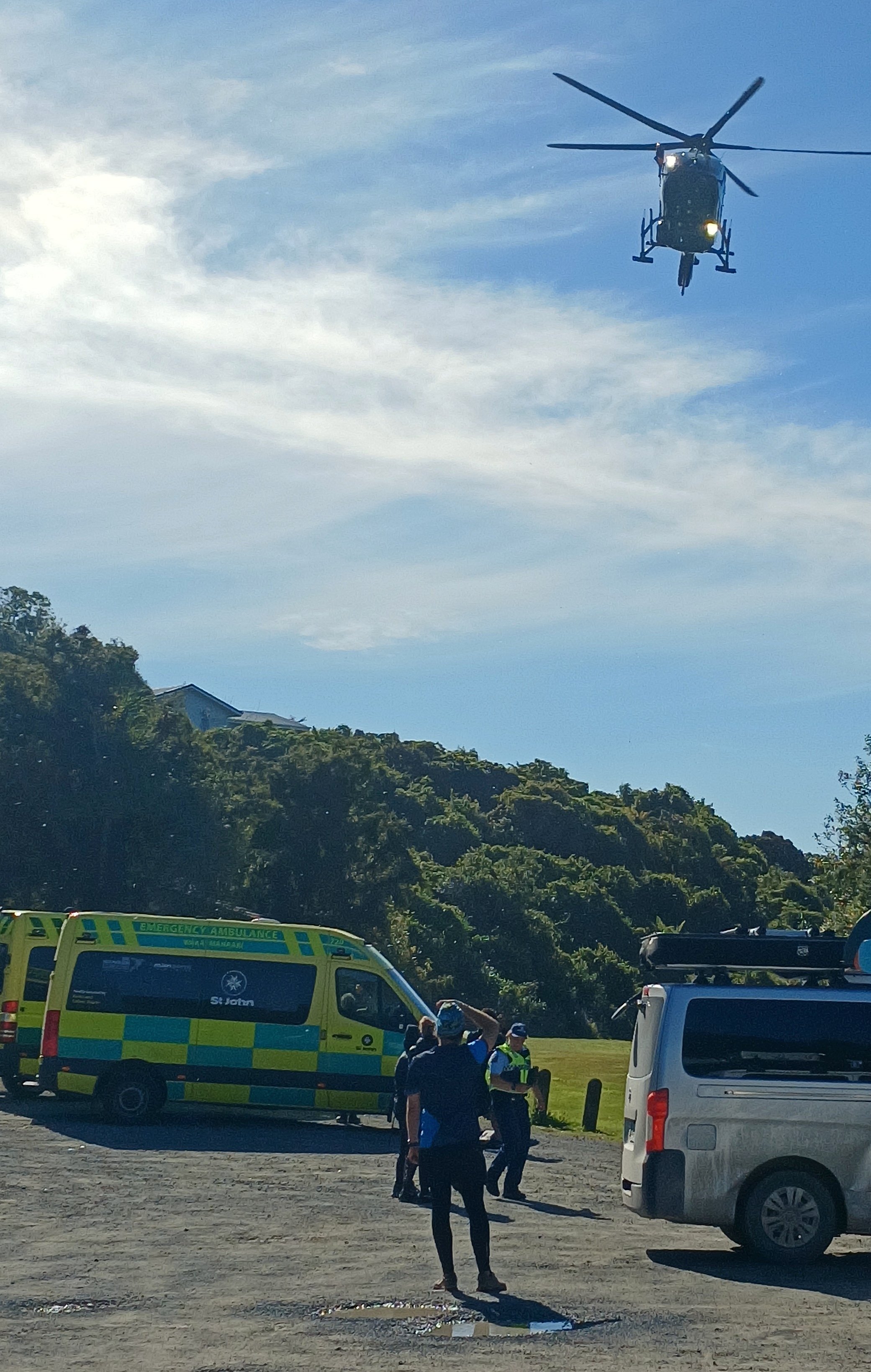 One of two rescue helicopters, each ferrying a waterlogged adventure racer to Dunedin hospital,...