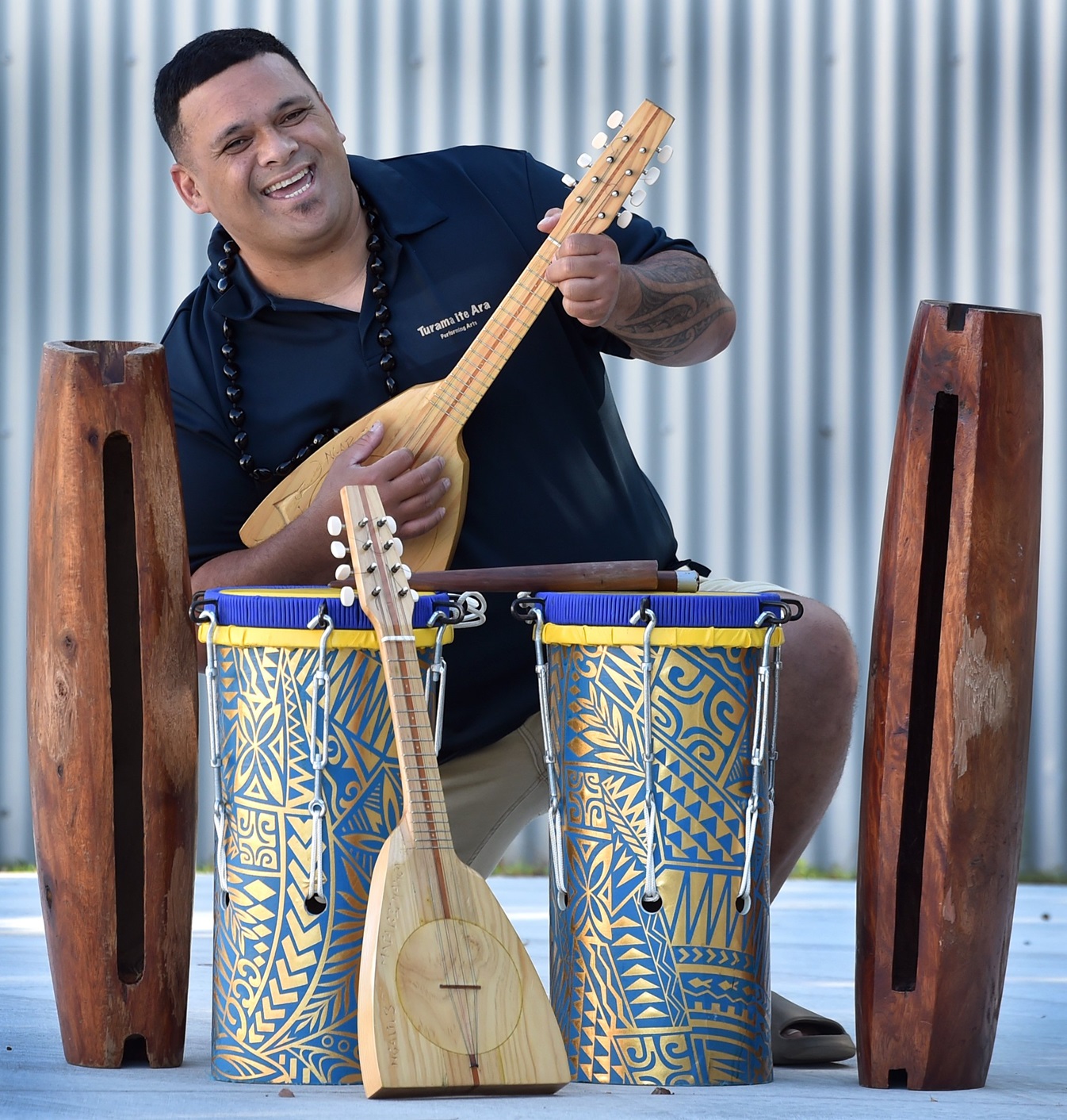 Turama Ite Ara performing arts group president Tai Tautua strums a ukulele ahead of the "Beat of...
