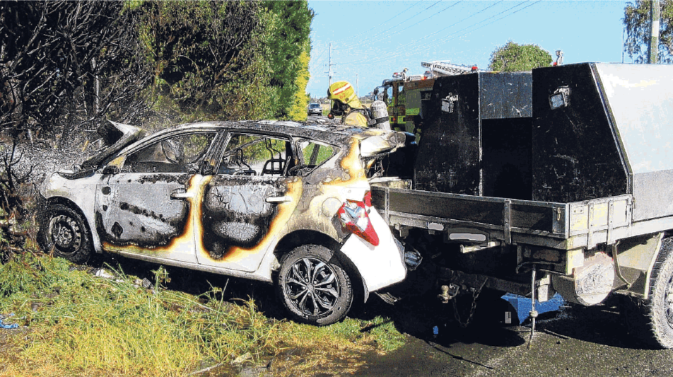 Ashburton firefighters at a car fire on the corner of Boundary Rd and Longbeach Rd. PHOTO: SUPPLIED