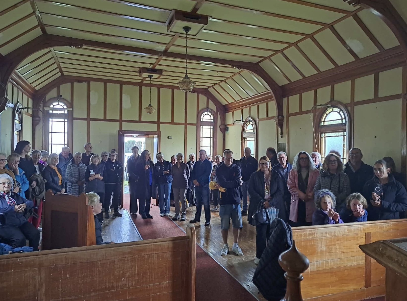 Local descendants and community members gather at Glenkenich Church for a ceremony before its...