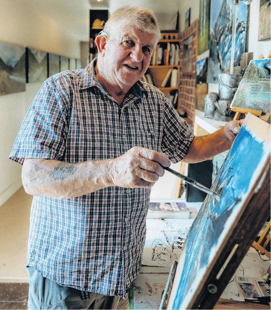 Mark Adams at work in his art gallery. PHOTO: SUPPLIED