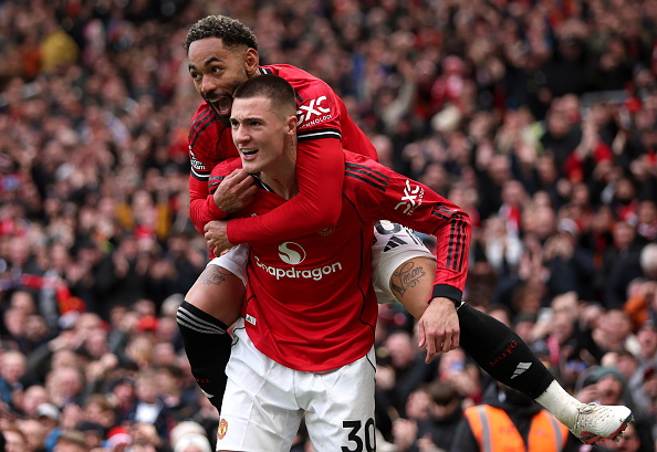 Benjamin Sesko of Manchester United celebrates scoring his team's third goal with teammate...