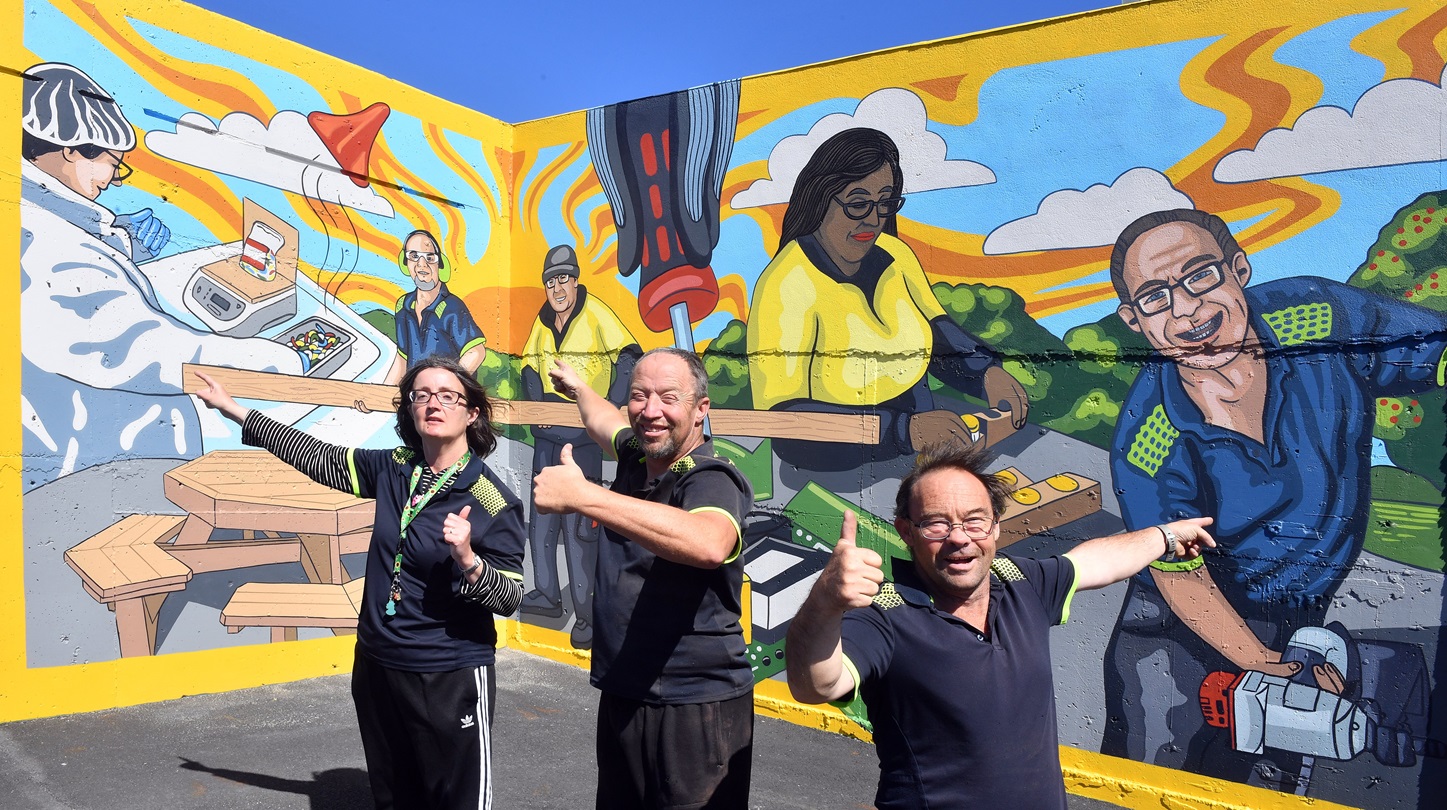 Proud Cargill Enterprise workers (from left) Lia Timpany, Nick Marr and Nathan Symister point out...
