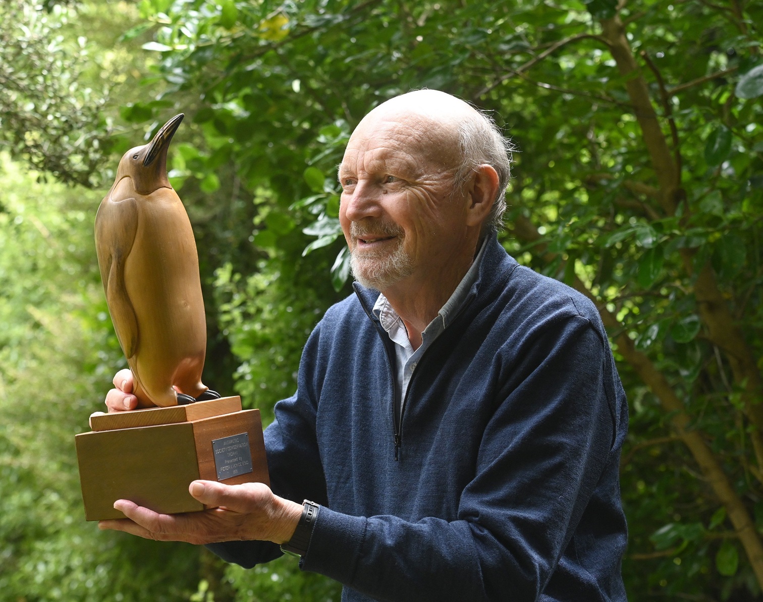 The late Neville Peat, of Dunedin, with the Antarctic Society Conservation Trophy he received in...