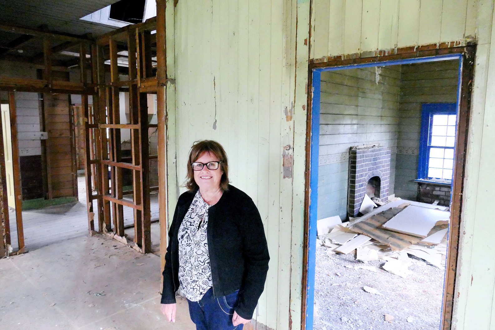 Lawrence Chinese Camp Charitable Trust member Debra Murray inspects preparatory restoration work...