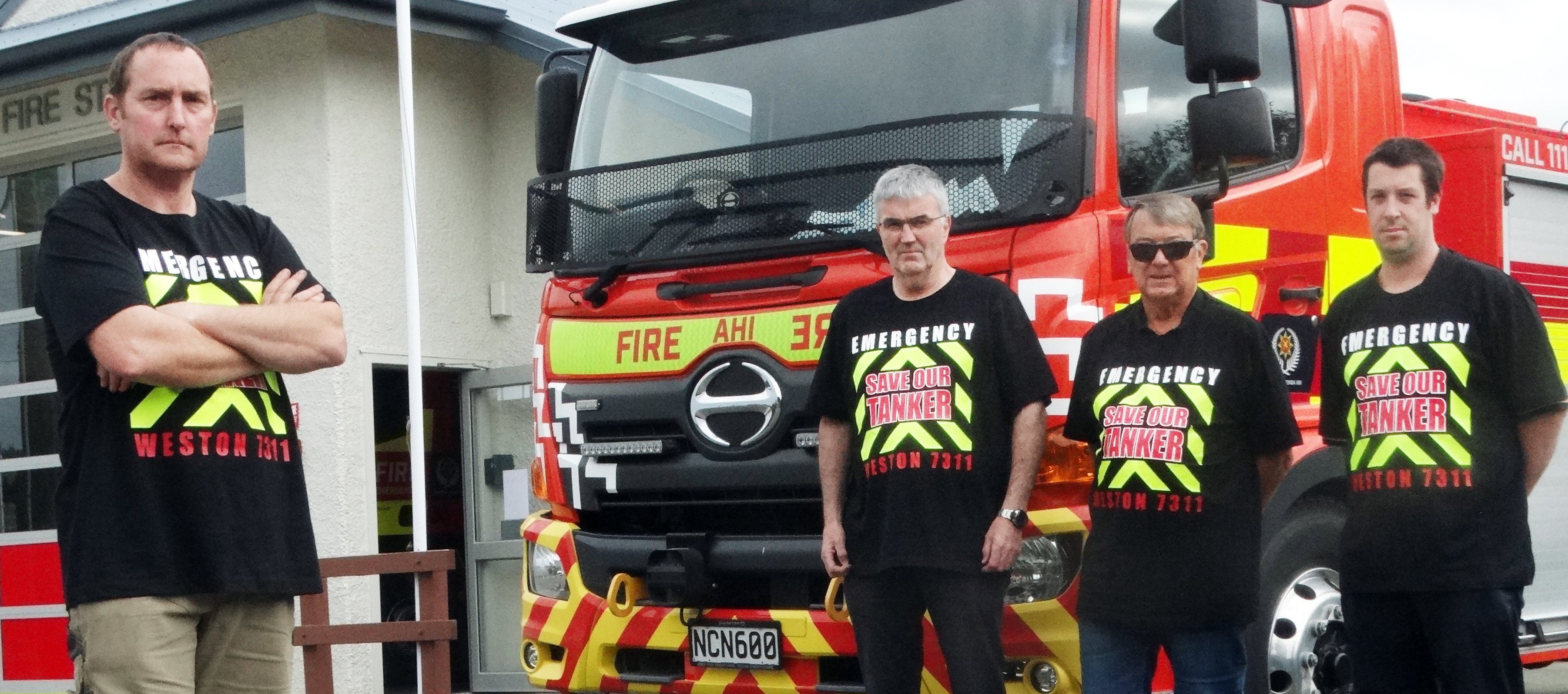 Weston Volunteer Fire Brigade Chief Fire Officer Richard Cranston (left) and fellow members (from...