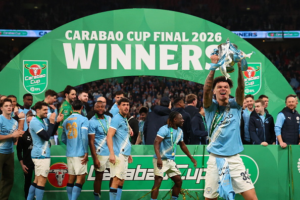 Nico O'Reilly lifts the Carabao Cup after scoring a double in Manchester City's final win. Photo:...