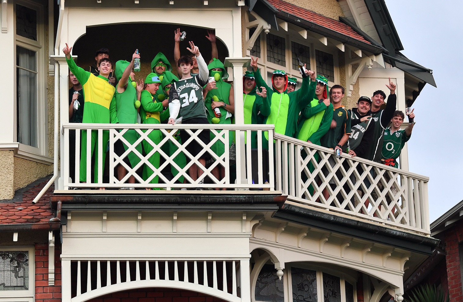 A group of people dressed in green above Stuart St let commuters know what they were celebrating...