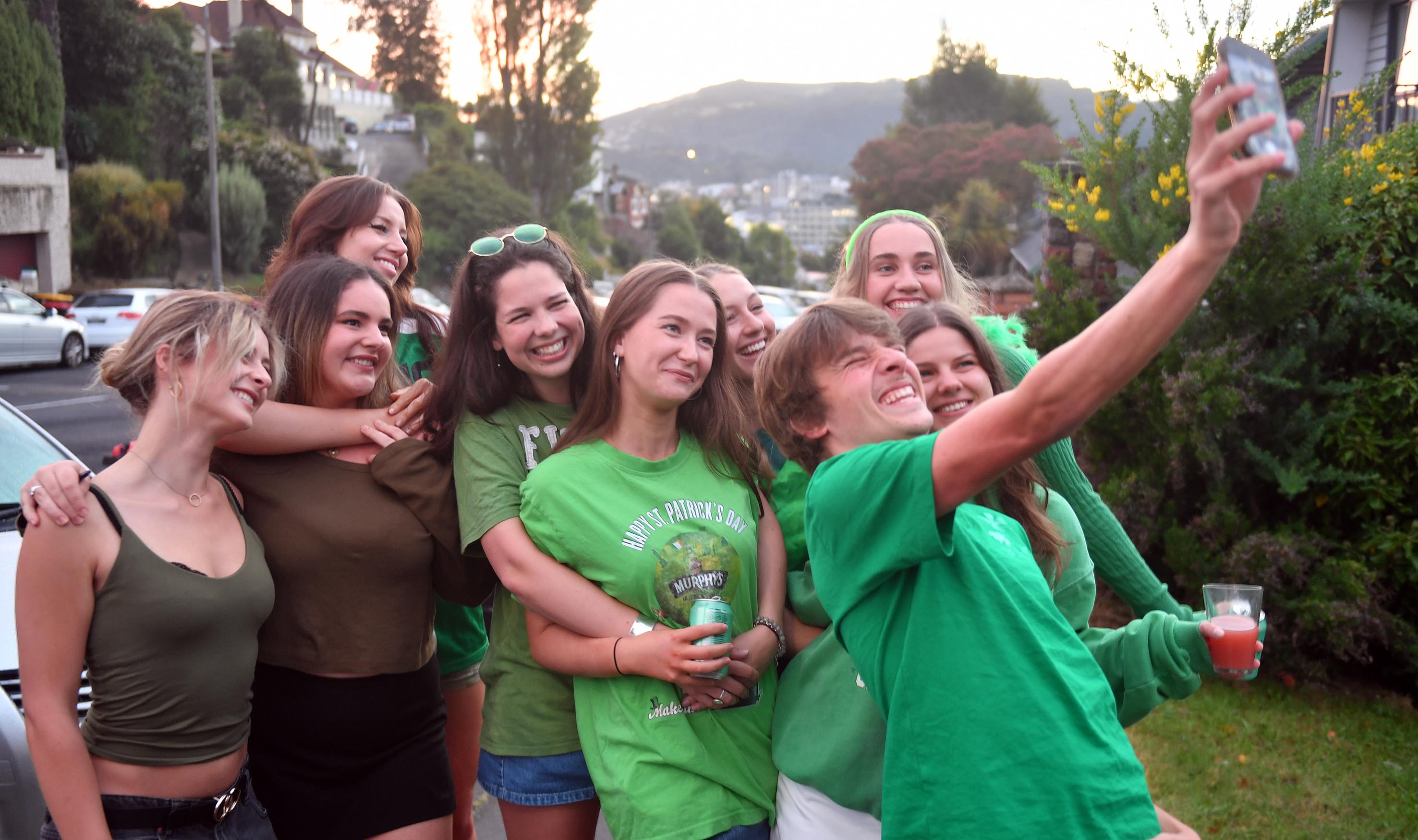 Students snap a selfie during early morning revelries on Cargill St today. Photo: Stephen Jaquiery 